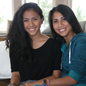 two nonwhite teenage girls smiling